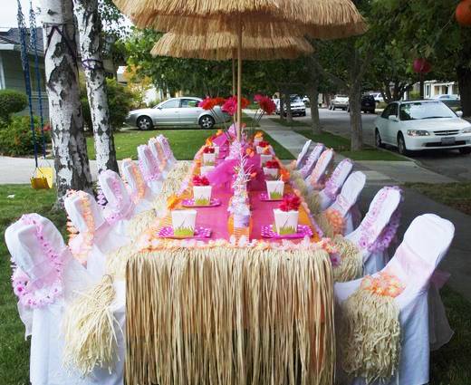 tropical party with thatch panels and thatch umbrella